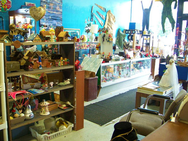 pictures of decorative miniture bird houses, child statues, pigging bank, wood box with latch, rubber figurines, wood welcome sign, matching candle sticks, miniture figurines, porciline chicken with eggs, large Hershey’s Kisses candy jar and holder, porciline knick knacks, light fixture parts, flash light, light bulbs, locker magnets, winnie the pooh stuffed miniture animals, stuffed animal key chain items, gremlin key chain, various sizes and artists vynil music records, electric clothing iron, small weights scale or balance, banjo, water skis, decorative ceramic mugs, ALL ITEMS FOR SALE