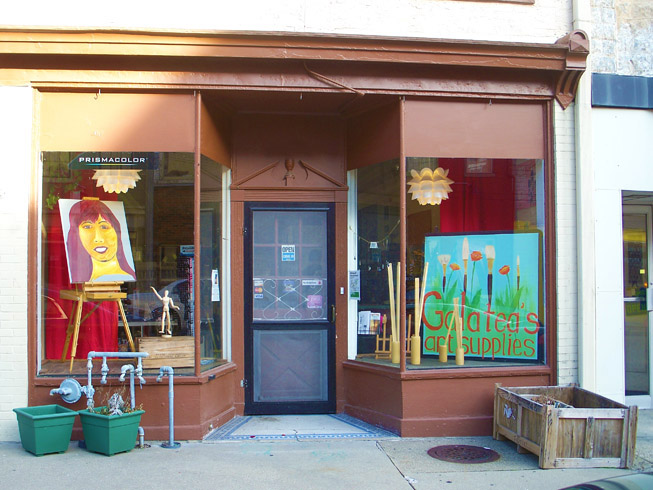 Storefront of Galatea’s Art Supply and Art Class Shop, Madison Historic District Shops, Downtown Madison Indiana, displaying original works of art.
