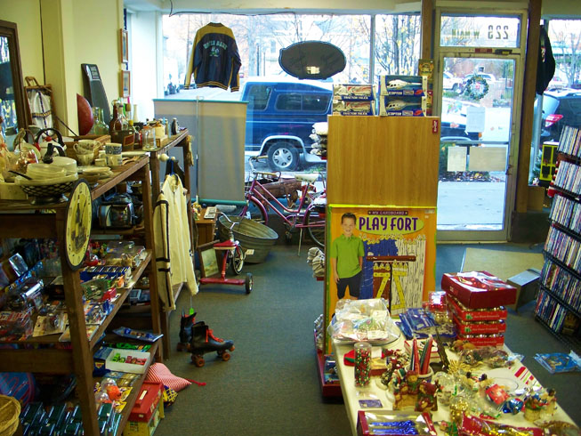 Items on sale at The Good Stuff include games, movies, VHS, DVD, clocks, jacket, bicycles, roller skates, candles, boxing gloves, tricycle, wash tub, toasters, collectibles toys, matchbox cars, christmas ornaments, toy house,