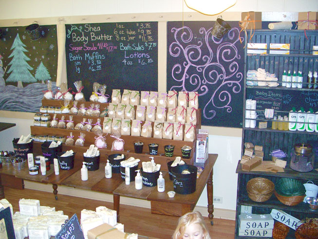 All Good Things homemade all natural soap products, picture of display table and shelves in store, at 318 West Main Street, Madison Historic District Indiana 47250.