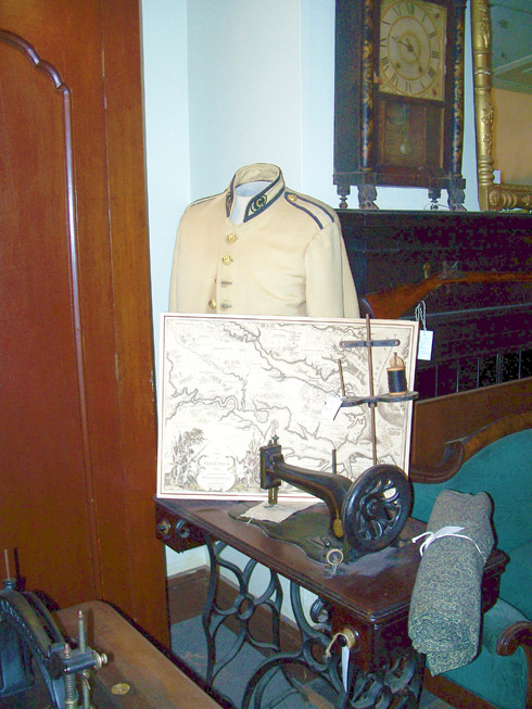 Military Uniform, sewing machine, and commemoritive map of Jamestown, Williamsburg, and Yorktown of Virginia